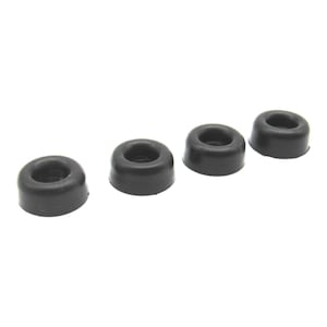 May include: Four black rubber bumpers, each with a circular shape and a small hole in the center.