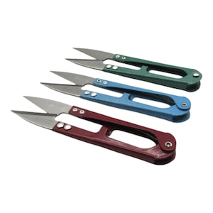 May include: Three pairs of small, sharp-pointed scissors with red, blue, and green handles. The scissors are designed for thread trimming.