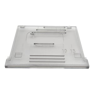 May include: A clear plastic sewing machine foot with markings for 10 and 15. The foot has a small opening in the center.