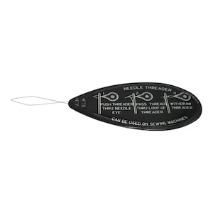 May include: Black plastic needle threader with a white loop and instructions on how to use it. The instructions read: "NEEDLE THREADER 1. PUSH THREADER THRU NEEDLE EYE 2. PASS THREAD THRU LOOP OF THREADER 3. WITHDRAW THREADER CAN BE USED ON SEWING MACHINES"