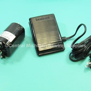 May include: A black sewing machine motor with a foot pedal and a power cord. The motor has a silver knob and a label that says "Vipersew".