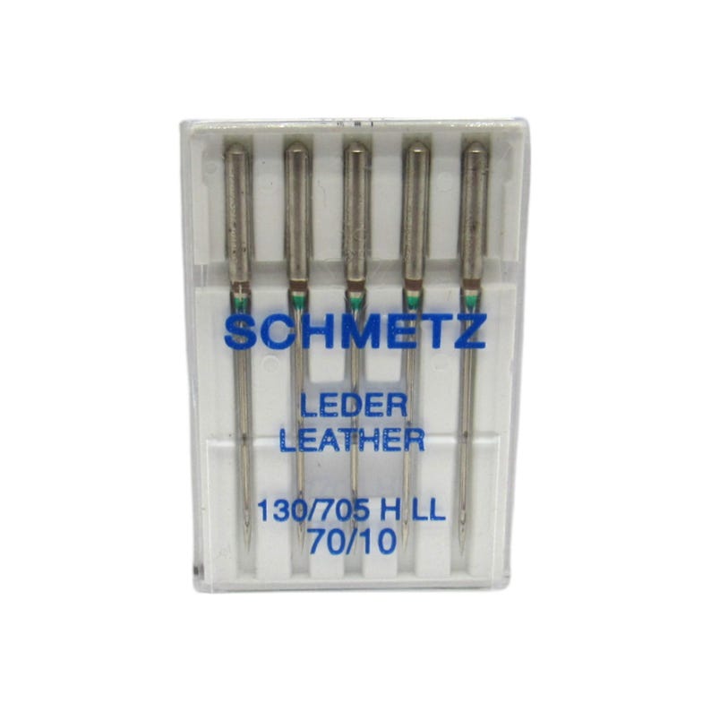 May include: A pack of five silver sewing needles in a clear plastic case. The needles are labeled "SCHMETZ LEDER LEATHER 130/705 H LL 70/10".