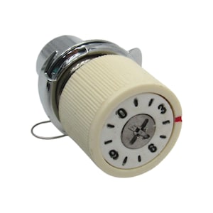 May include: A sewing machine tension dial with a cream-coloured, ribbed body and a chrome-coloured metal top. The dial has numbers from 0 to 9 and a red indicator line. A small metal wire extends from the side.