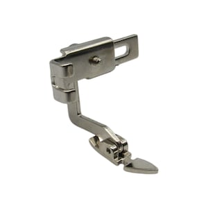 May include: A silver sewing machine foot with a curved arm and a pointed tip.