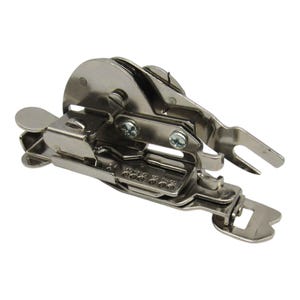 May include: A silver sewing machine foot with a round dial and a lever. The foot has a series of numbers on the side, ranging from 1 to 8.