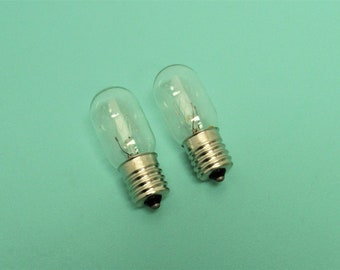 2 New 15 watt,  120 volt, medium glass, clear, 5/8 base, screw in style bulb