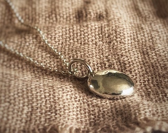 Silver pebble fiddle anxiety necklace