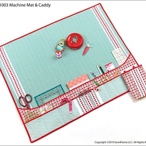 May include: A turquoise sewing machine mat with red trim and multiple pockets. The mat has a white and red patterned fabric lining the pockets. The mat is filled with sewing supplies, including scissors, thread spools, a tape measure, and pencils.