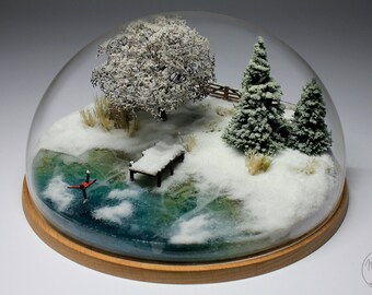 Winter miniature landscape skating on frozen lake under a half-sphere acrylic glass diorama interior decoration