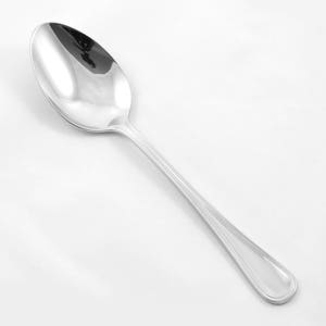 May include: A silver spoon with a rounded bowl and a slightly curved handle. The spoon has a polished finish and a simple design.