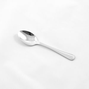 May include: A silver teaspoon with a rounded bowl and a slightly curved handle.