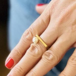 Pearl jewelry. Freshwater pearl on a gold ring. Stackable ring in gold