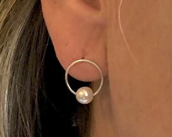 Pearl earrings. Freshwater pearls in a ring of silver. Dangle earrings, you can wear them for every occasion.