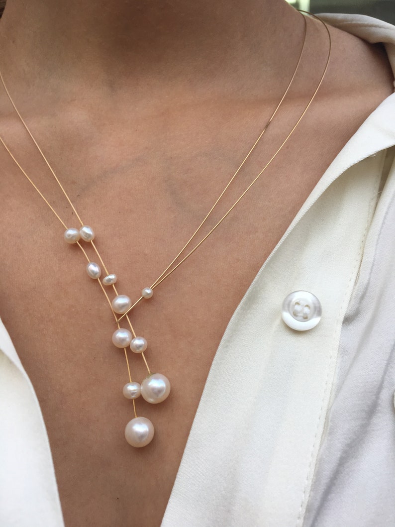 Pearl necklace. Freshwater pearls on a wire of gold. You can vary the lenght by yourself, by fixing one end on a position. image 7