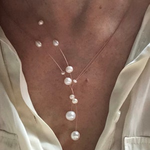 Pearl necklace. Freshwater pearls on a wire of gold. You can vary the lenght by yourself, by fixing one end on a position. image 5