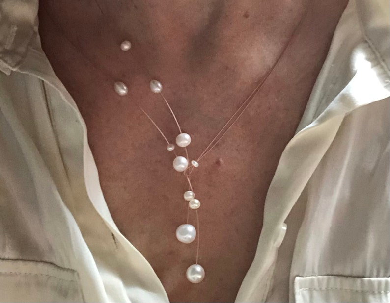 Pearl necklace. Freshwater pearls on a wire of gold. You can vary the lenght by yourself, by fixing one end on a position. image 5