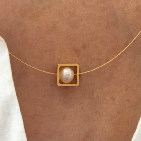 Pearl necklace. Genuine pearl in a gold square on a wire of gold. You can vary the lenght by yourself.