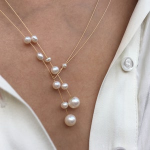 Collier de perles. Perles d'eau douce sur fil d'or. Vous pouvez varier la longueur vous-même, en fixant une extrémité sur une position. Collier lasso image 6