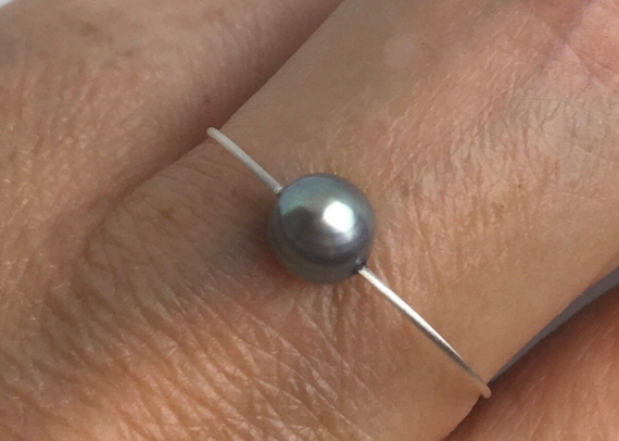 Pearl ring. Dainty ring. Gray freshwater pearl on a wire of silver. Stackable