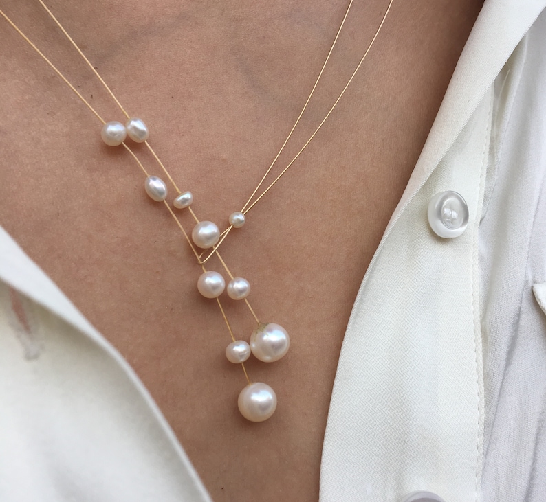 Pearl necklace. Freshwater pearls on a wire of gold. You can vary the lenght by yourself, by fixing one end on a position. image 5