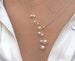 Pearl necklace. Freshwater pearls on a wire of gold. You can vary the lenght by yourself, by fixing one end on a position. 