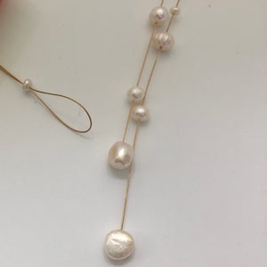 Pearl necklace. Freshwater pearls on a wire of gold. You can vary the lenght by yourself, by fixing one end on a position. image 6