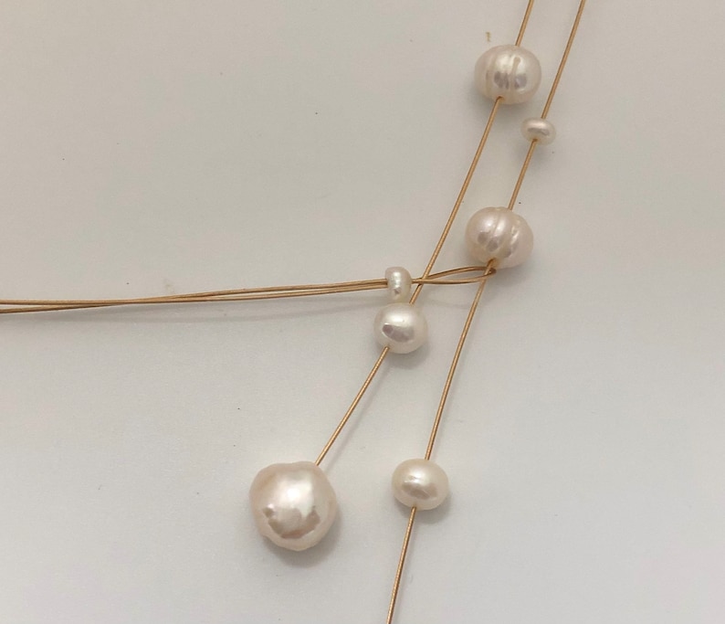 Pearl necklace. Freshwater pearls on a wire of gold. You can vary the lenght by yourself, by fixing one end on a position. image 9