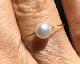 Freshwater pearl ring. Classic pearls on a wire of gold. Dainty ring