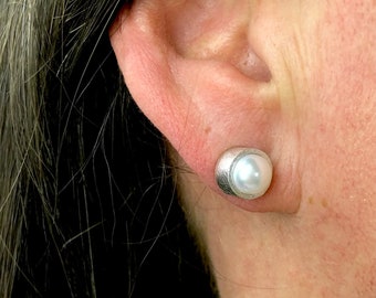 Pearl earrings. Silver studs.Genuine pearls in a tube of silver. Drop earrings, you can wear them for every occasion.