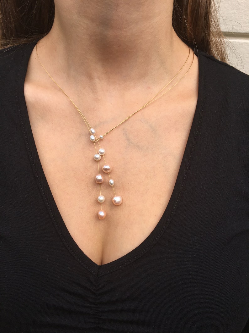 Jewelry Set. Pearl necklace on a wire of gold and a gold ring with freshwater pearl. image 6