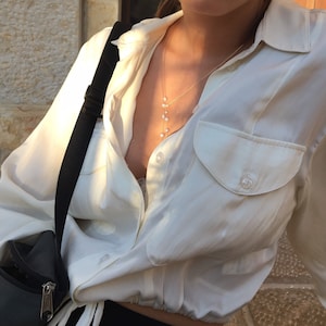 Jewelry Set. Pearl necklace on a wire of gold and a gold ring with freshwater pearl for free.Lariat necklace for everyday