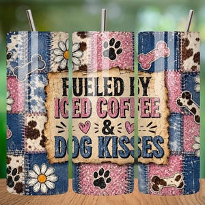 May include: A tumbler with a patchwork design featuring denim, cowhide, and pink glitter accents. The tumbler has a stainless steel straw and the text "Fueled by Iced Coffee & Dog Kisses". Includes dog paw prints, bones, and daisy flowers.