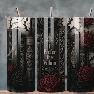 May include: A stainless steel tumbler with a black and grey design featuring stacked books, red roses, and the text "I Prefer the Villain." The tumbler has a silver straw and a clear lid. The design is gothic-inspired.