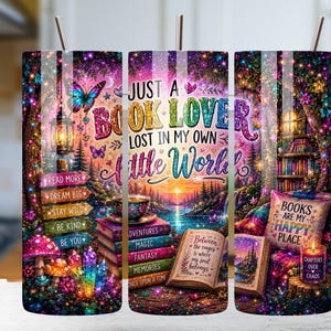 May include: A cylindrical tumbler with a straw featuring a vibrant, colorful illustration of a forest scene with books, a lantern, butterflies, mushrooms, and crystals. The text reads: JUST A BOOK LOVER LOST IN MY OWN LITTLE WORLD, BOOKS ARE MY HAPPY PLACE.