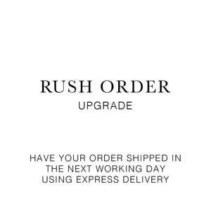 May include: A white background with black text. The text reads "RUSH ORDER UPGRADE". Below, the text states "HAVE YOUR ORDER SHIPPED IN THE NEXT WORKING DAY USING EXPRESS DELIVERY".