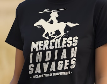 May include: A black t-shirt with a white graphic of a Native American riding a horse. The text on the shirt reads "Merciless Indian Savages - Declaration of Independence - "