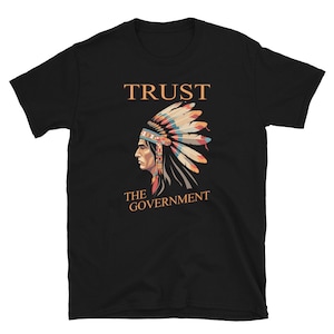 May include: Black t-shirt with a graphic of a Native American wearing a headdress and the text "TRUST THE GOVERNMENT".