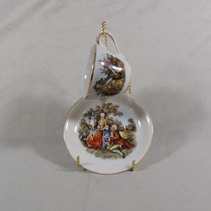 S G K China Occupied Japan Courting Couple Demitasse Cup and Saucer