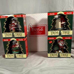 Coca Cola Trim A Tree Santa Claus Ornaments, Set of Four in Original Boxes — 1935, 1958, 1963 and 1964