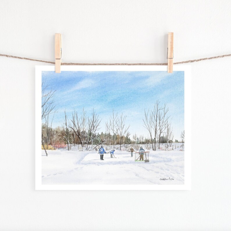 May include: A watercolor painting of a winter scene with four people playing hockey on a frozen pond. The pond is surrounded by trees and the sky is blue. The painting is signed "Debbie E. Lu" in the bottom right corner.