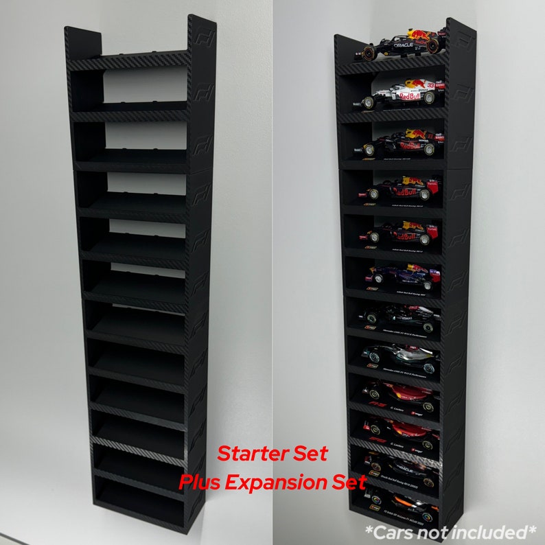 May include: Black wall-mounted display shelf with 12 slots for displaying miniature cars. The shelf is made of a carbon fiber-like material and has a Formula 1 logo on the side. The text "Starter Set Plus Expansion Set" is printed below the shelf. The text "*Cars not included*" is printed below the shelf on the right side.