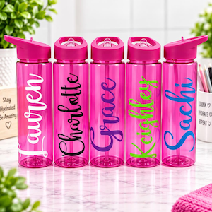 May include: Five translucent hot pink plastic water bottles with flip-top lids and straws. Each bottle features a personalized name in a different color script font: Lauren in white, Charlotte in black, Grace in purple, Keighley in lime green, and Sachi in blue.