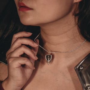 VAELITH sword and shield knight fantasy necklace in sterling silver and bronze
