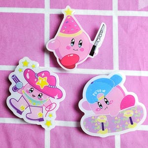 May include: Three pink and white cartoon character stickers. One character is wearing a party hat and holding a knife. Another character is wearing a cowboy hat and holding a microphone. The third character is wearing a blue baseball cap and riding a skateboard.