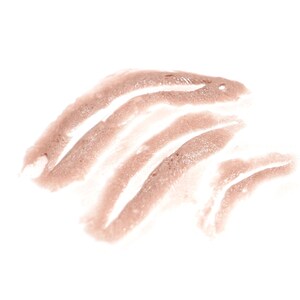 May include: A close-up of a cosmetic product swatch. The product is a light brown color, applied in a series of curved strokes. The strokes are slightly textured and appear to be a creamy or liquid formula. The background is plain white.