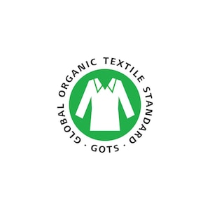 May include: A circular green logo with the words "GLOBAL ORGANIC TEXTILE STANDARD" in a circular pattern. Inside the circle is a white illustration of a shirt. The word "GOTS" is at the bottom of the circle.