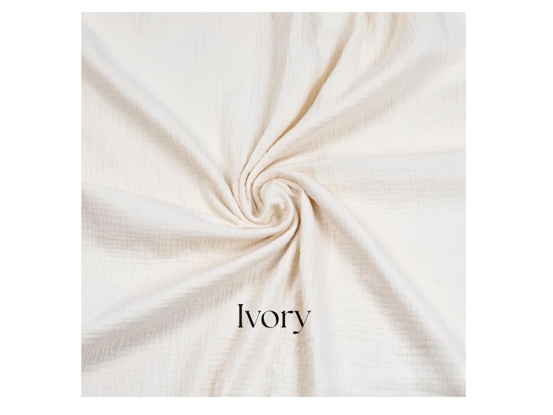 May include: Ivory-colored fabric with a textured, crinkled appearance, arranged in a swirling pattern. The word "Ivory" is printed in a black, sans-serif font at the bottom. The fabric appears soft and lightweight.
