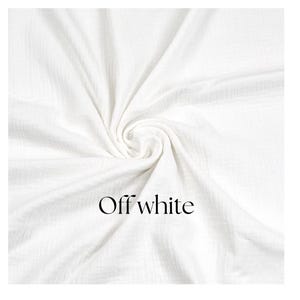 May include: Off-white fabric with a textured weave, artfully draped and swirled. The fabric is a soft, neutral color, and the words "Off white" are printed in a simple, elegant font.