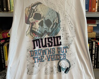 May include: A white sleeveless shirt with a graphic print of a skull wearing headphones. The text "MUSIC DROWNS OUT THE VOICES" is printed below the skull.