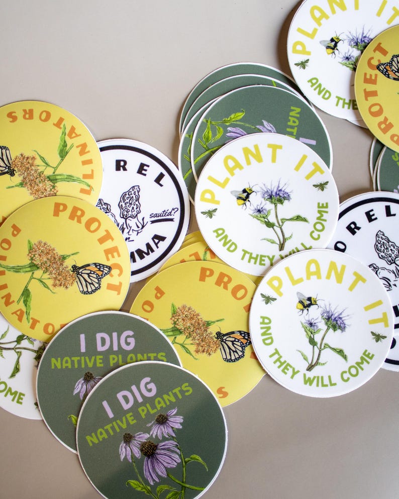 May include: A collection of round stickers with nature-themed designs. Some stickers feature text like "Plant It and They Will Come" and "I Dig Native Plants." The stickers showcase illustrations of bees, butterflies, and flowers in various colors.